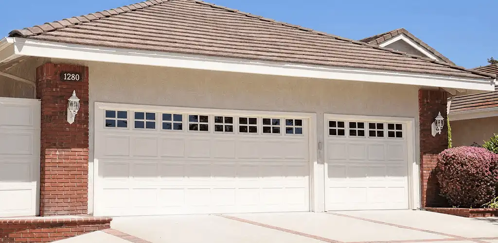 Residential garage door repair service for a double garage door in Kansas City, KS
