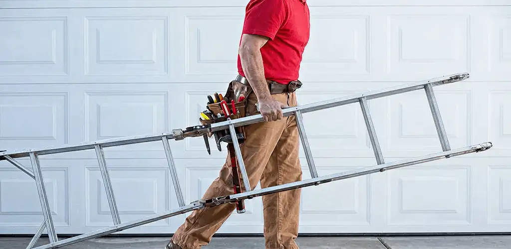 Garage door repair technician arriving with tools and ladder in Kansas City, KS
